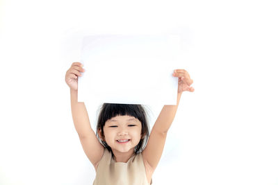 Portrait of a smiling girl over white background