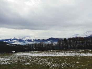 Scenic view of snowcapped mountains against sky