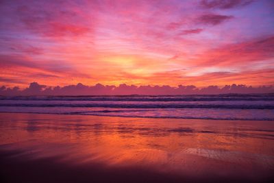 Scenic view of sea against romantic sky at sunset