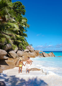 Scenic view of beach against clear blue sky