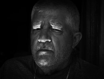 Close-up portrait of man, black and white