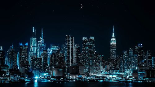 Illuminated buildings in city at night