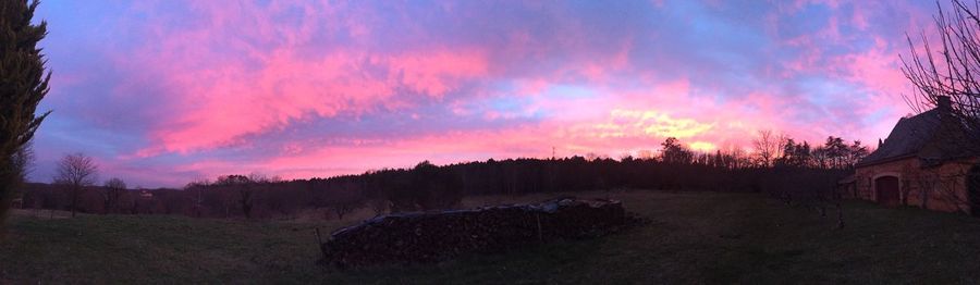 Scenic view of dramatic sky at sunset