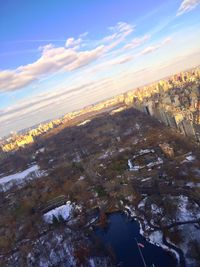 Aerial view of cityscape against sky