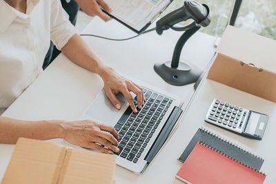 High angle view of man working on table