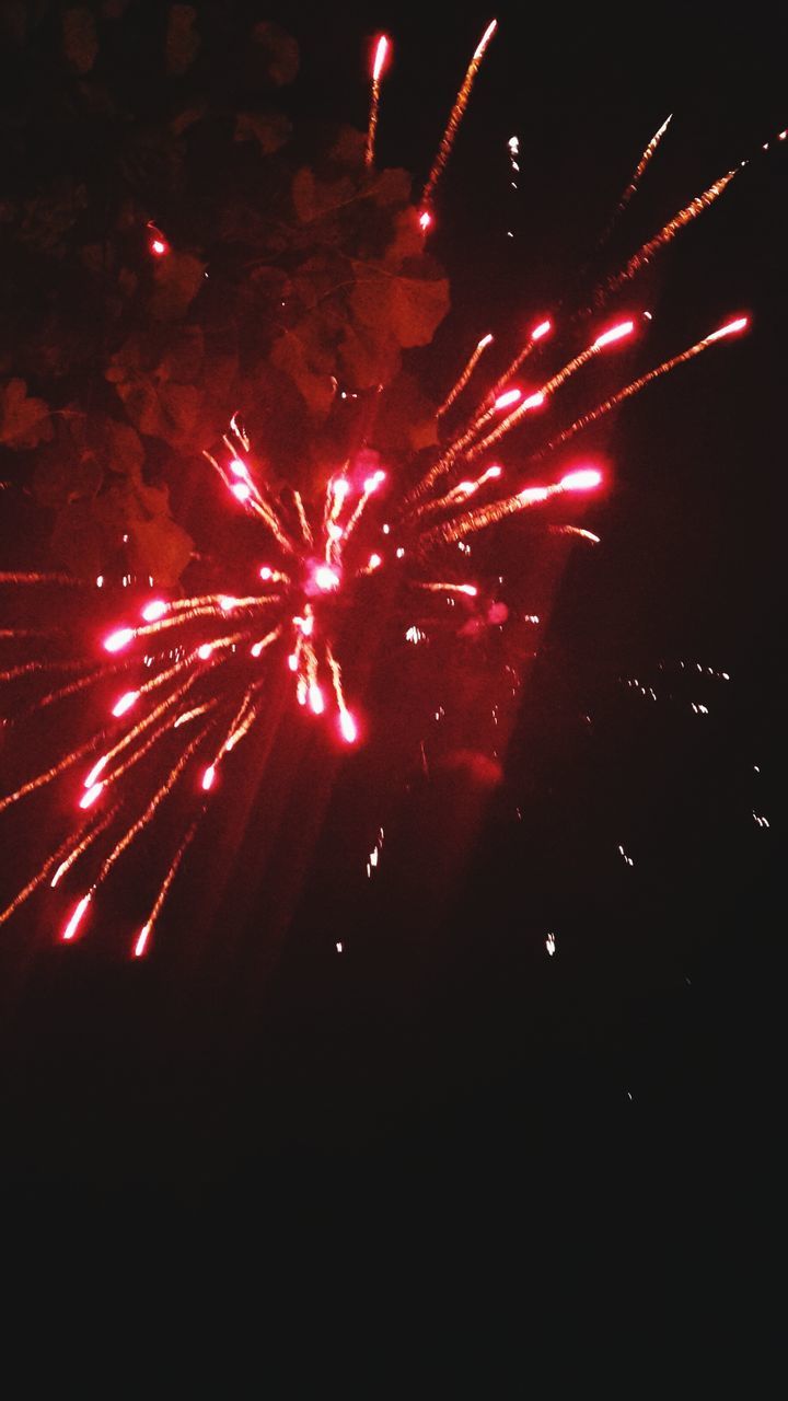 night, illuminated, celebration, firework display, long exposure, exploding, firework - man made object, arts culture and entertainment, motion, event, glowing, low angle view, sparks, firework, blurred motion, red, lighting equipment, entertainment, sky, multi colored