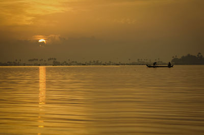 Scenic view of sea at sunset