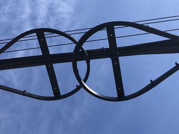 Low angle view of metallic structure against sky