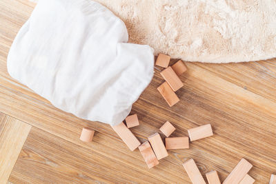 High angle view of white lying on table at home