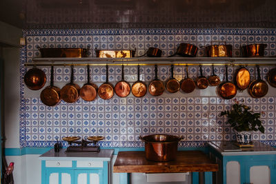 Utensils hanging against wall in kitchen