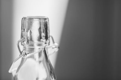 Close-up of bottle against wall