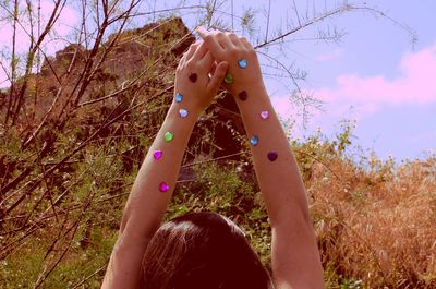 Woman standing on grassy field