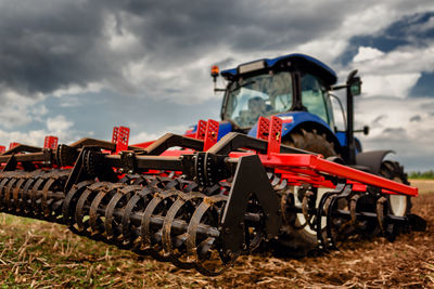 Tractor on field against sky