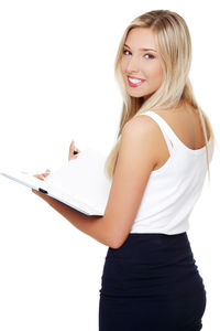 Portrait of a smiling young woman against white background