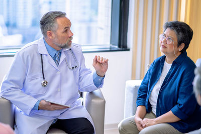 Doctor examining patient in hospital