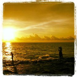 Scenic view of sea at sunset