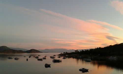 Scenic view of lake at sunset