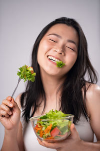 Portrait of woman eating food