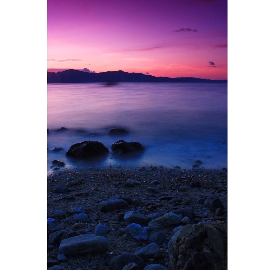 transfer print, scenics, water, auto post production filter, tranquil scene, beauty in nature, tranquility, rock - object, sky, nature, sunset, sea, idyllic, rock, mountain, non-urban scene, rock formation, horizon over water, non urban scene, shore