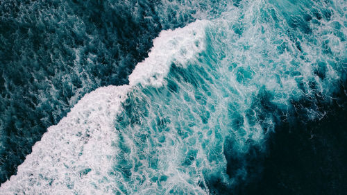 High angle view of water splashing in sea