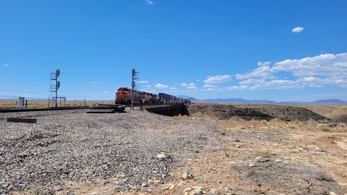 Train on railroad track against sky