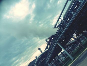 Low angle view of building against cloudy sky