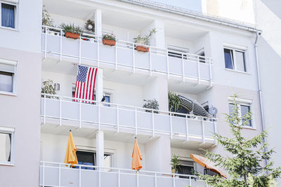 Low angle view of flags hanging on building