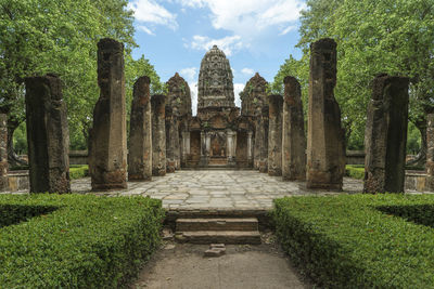 View of temple amidst trees against sky