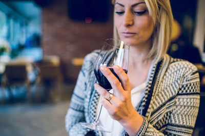 Close-up of woman drinking wine