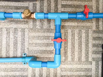Close-up of blue pipe against wall