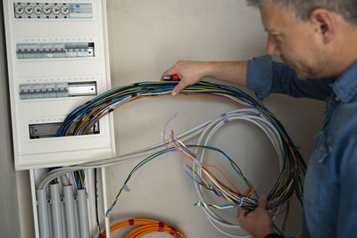 Side view of man working in factory