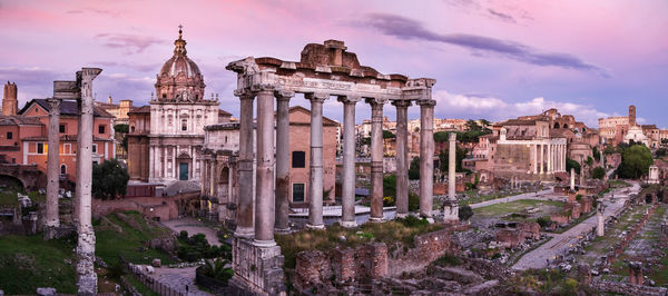 Panoramic view of buildings in city against sky