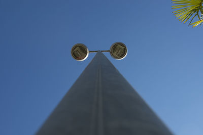 Low angle view of built structure against clear blue sky