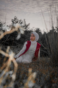 Full length of woman on field during winter