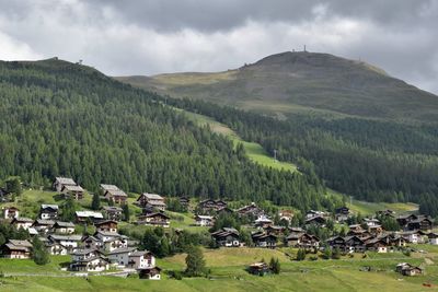 Townscape and mountains against sky