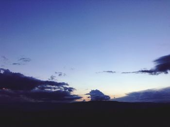 Silhouette of landscape against sky at sunset