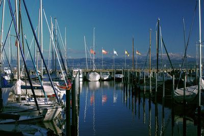 Boats moored at harbor