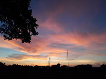 Silhouette trees against sky during sunset