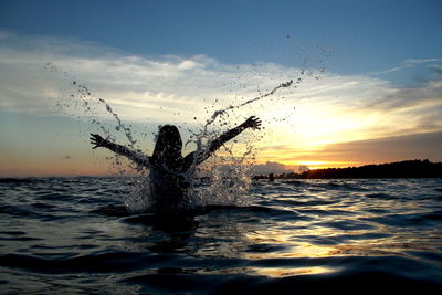 Scenic view of sea at sunset