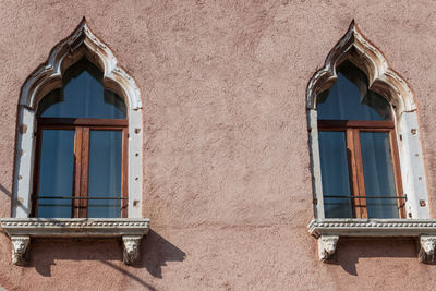 Low angle view of window on wall of building