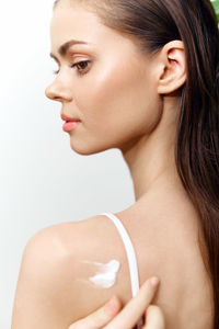 Close-up of young woman looking away