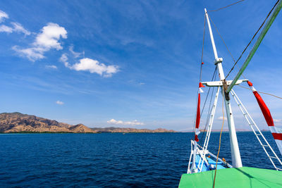 Sailboat on sea against blue sky