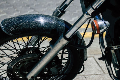 Close-up of bicycle parked on street