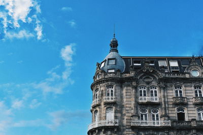 Low angle view of building against blue sky