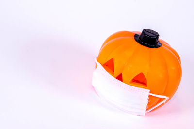 Close-up of orange juice against white background