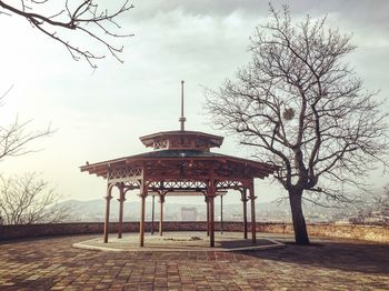 Gazebo in park against sky