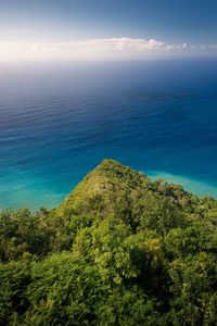 Scenic view of sea against blue sky