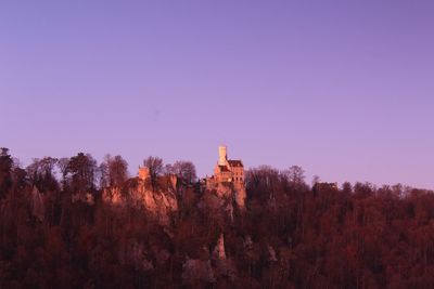 View of trees and buildings against sky