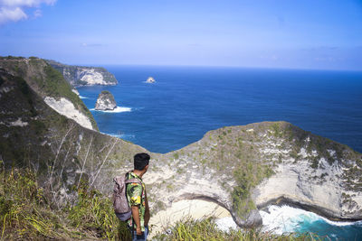 Scenic view of sea and rocks against sky