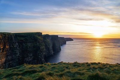 Scenic view of sea against sky during sunset